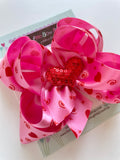 Satin double stacked bow for Valentines Day with sequin heart center - Darling Little Bow Shop